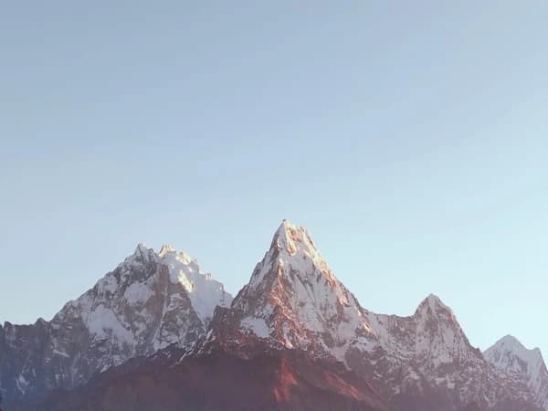 Enjoying a golden sunrise view of snow-capped Annapurna peaks druing Mohare Danda family trek with children and seniors